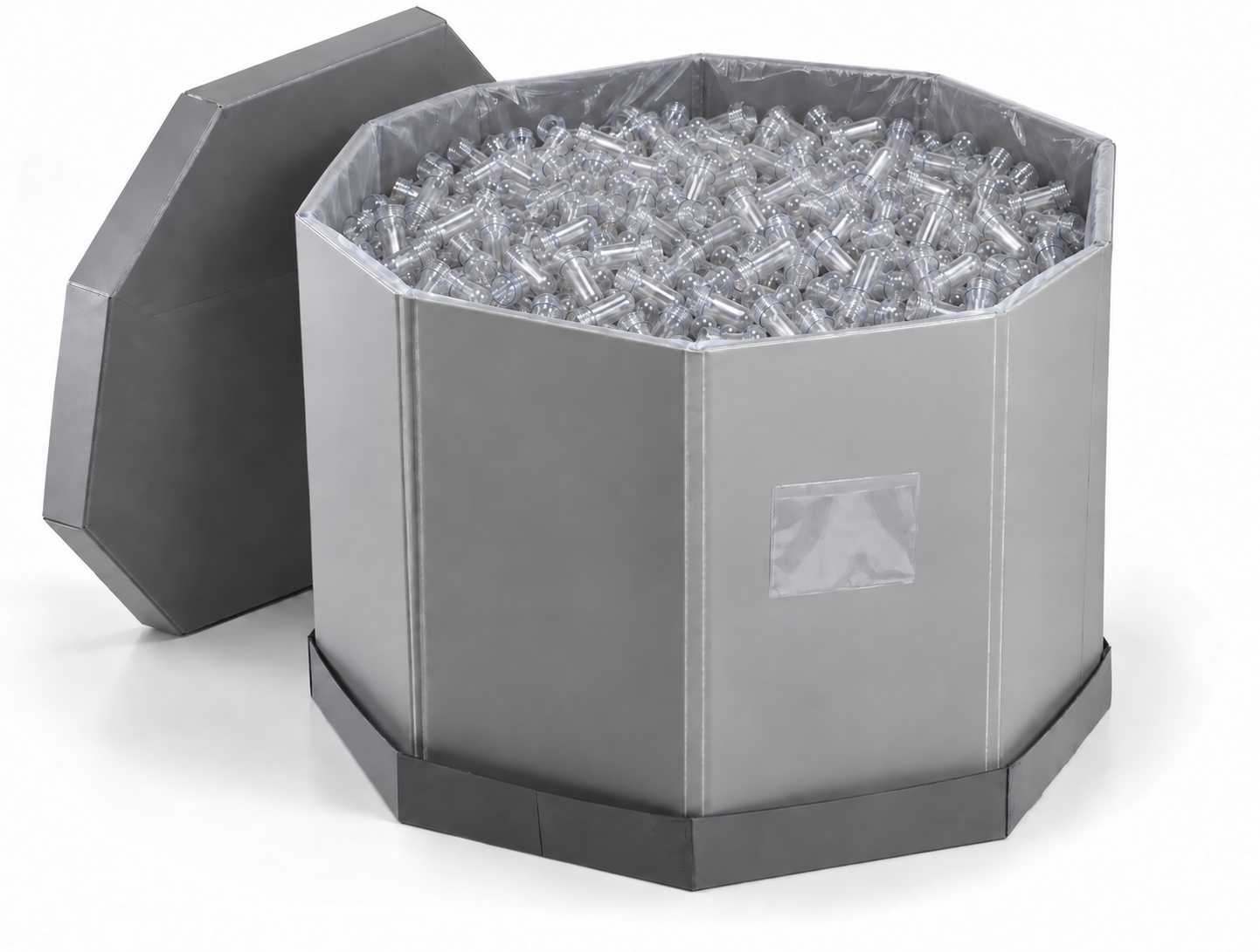 Open OCTAPAK reusable panel container filled with small PET preforms, with its lid beside it
